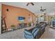 Open concept living room with tile flooring, high ceilings, and seamlessly connected dining area at 37 Naranja Rd, Debary, FL 32713
