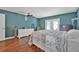 Comfortable main bedroom with hardwood floors, neutral tones, and lots of natural light at 37 Naranja Rd, Debary, FL 32713