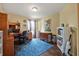 Home office with a desk, bookshelves, and a comfortable workspace at 37 Naranja Rd, Debary, FL 32713
