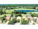 Aerial view of a single Gathering home with a golf course and lake visible in the distance at 438 Harbour Town Ln, Ormond Beach, FL 32174