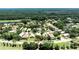 Lovely aerial view showcasing this home’s location in a golf course community near a pond and lush landscape at 438 Harbour Town Ln, Ormond Beach, FL 32174