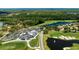 An aerial view of a golf course with a clubhouse at 438 Harbour Town Ln, Ormond Beach, FL 32174