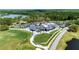 Aerial shot of golf course with putting green and clubhouse at 438 Harbour Town Ln, Ormond Beach, FL 32174