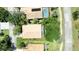 Aerial view of a single Gathering home, showcasing the roof, yard, driveway and neighboring property at 438 Harbour Town Ln, Ormond Beach, FL 32174