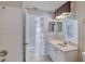 Bathroom showcasing tile floors, white vanity and mirror with decorative lighting at 438 Harbour Town Ln, Ormond Beach, FL 32174