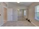 Bedroom featuring neutral paint and carpet, mirrored closet, and shuttered windows at 438 Harbour Town Ln, Ormond Beach, FL 32174