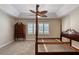 This bedroom features a four-poster bed frame and a matching chest of drawers at 438 Harbour Town Ln, Ormond Beach, FL 32174