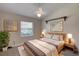 Bedroom featuring neutral paint, carpet, and shuttered windows and artwork at 438 Harbour Town Ln, Ormond Beach, FL 32174