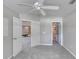 Carpeted bedroom with double doors to the living room and bathroom at 438 Harbour Town Ln, Ormond Beach, FL 32174