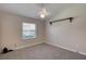 Bedroom featuring neutral paint, carpet, and shuttered windows and shelf at 438 Harbour Town Ln, Ormond Beach, FL 32174