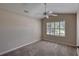 Neutral bedroom with carpeted floors, plantation shutters, and ceiling fan at 438 Harbour Town Ln, Ormond Beach, FL 32174