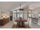 Elegant dining room with large windows, modern lighting, and tile floors at 438 Harbour Town Ln, Ormond Beach, FL 32174