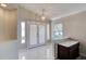 Bright foyer with neutral walls, tile flooring, and a decorative light fixture at 438 Harbour Town Ln, Ormond Beach, FL 32174