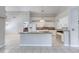 Bright kitchen features a center island, white cabinets, and tile flooring at 438 Harbour Town Ln, Ormond Beach, FL 32174
