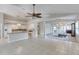 Open-concept living space with tile floors, neutral walls, and modern lighting at 438 Harbour Town Ln, Ormond Beach, FL 32174
