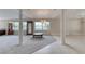 Open-concept living space with pillars, tile flooring, and abundant natural light at 438 Harbour Town Ln, Ormond Beach, FL 32174