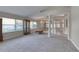 Expansive living room with plush carpet, large windows, and elegant architectural details at 438 Harbour Town Ln, Ormond Beach, FL 32174