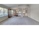 Spacious living room features high ceilings, neutral walls, and large windows with lots of light at 438 Harbour Town Ln, Ormond Beach, FL 32174