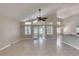 Bright open living space with high ceilings, tile floors, and access to the outdoors at 438 Harbour Town Ln, Ormond Beach, FL 32174