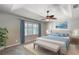 Main bedroom features a ceiling fan, window with shutters, and neutral decor at 438 Harbour Town Ln, Ormond Beach, FL 32174