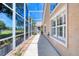 Screened patio offering relaxing outdoor space with well-maintained landscaping at 438 Harbour Town Ln, Ormond Beach, FL 32174