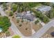 Aerial view of a single story home that shows the surrounding neighborhood and ample lot size at 45 S University Cir, Deland, FL 32724