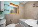 Updated bathroom featuring tile floors, a shower, and a large mirror for added brightness at 45 S University Cir, Deland, FL 32724