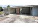 A large screened carport and ample parking space, providing a unique and functional outdoor feature at 45 S University Cir, Deland, FL 32724