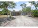 Carport has decorative screening and allows access to the house with ample space for multiple vehicles at 45 S University Cir, Deland, FL 32724