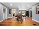 Dining room with hardwood floors, seating for four, and light gray walls at 45 S University Cir, Deland, FL 32724