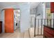 Bright laundry room features a side-by-side washer and dryer, with an orange sliding door at 45 S University Cir, Deland, FL 32724