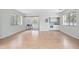 Open floor plan living room that connects to a kitchenette and sunroom at 45 S University Cir, Deland, FL 32724