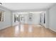 Spacious living room featuring tile flooring and natural light from the windows at 45 S University Cir, Deland, FL 32724