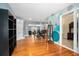 Living Room boasts hardwood floors, accent wall, and transitions into the dining room and other living spaces at 45 S University Cir, Deland, FL 32724
