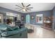 Living room featuring lots of light, tile floors, comfortable furniture, and fireplace at 45 S University Cir, Deland, FL 32724