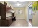 Office featuring tile flooring, natural light, a built-in desk and access to the entrance at 45 S University Cir, Deland, FL 32724