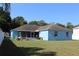 Backyard with a covered patio and ample space for outdoor activities at 4611 Se 32Nd Pl, Ocala, FL 34480