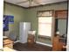 Functional bedroom featuring wood floors, neutral wall, and plenty of space at 4611 Se 32Nd Pl, Ocala, FL 34480