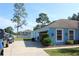 Garage exterior showing a large white door and landscaped area at 4611 Se 32Nd Pl, Ocala, FL 34480