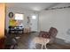 Cozy living room with hardwood floors, a tv and a sitting area at 4611 Se 32Nd Pl, Ocala, FL 34480
