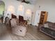 Open living room featuring high ceilings, archways, modern lighting, and sleek furniture at 4611 Se 32Nd Pl, Ocala, FL 34480