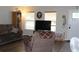 Inviting living room with wood flooring, natural light, and a comfortable seating area at 4611 Se 32Nd Pl, Ocala, FL 34480