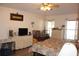 Comfortable main bedroom with plenty of space, natural light, and ceiling fan at 4611 Se 32Nd Pl, Ocala, FL 34480