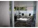 Enclosed porch area perfect for outdoor seating and enjoying the weather at 4611 Se 32Nd Pl, Ocala, FL 34480