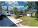 Backyard with a grassy area, trampoline, concrete pad, and storage shed at 487 Collins St, Ormond Beach, FL 32174