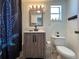 Bathroom with updated vanity, sink, mirror, and modern fixtures at 487 Collins St, Ormond Beach, FL 32174