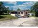 Charming single-story home featuring a well-maintained lawn, concrete driveway, and inviting entryway at 487 Collins St, Ormond Beach, FL 32174