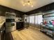 Updated kitchen featuring stainless steel appliances, dark cabinetry, and ample counter space for meal preparation at 487 Collins St, Ormond Beach, FL 32174