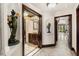 Elegant bathroom with a vessel sink, dark wood cabinetry, and intricate tile work in a luxurious home at 5366 N Lake Farms Rd, De Leon Springs, FL 32130