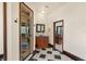 Hallway view of the charming bathroom with a walk-in shower and vanity at 5366 N Lake Farms Rd, De Leon Springs, FL 32130